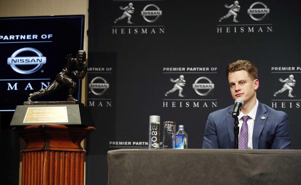 Joe Burrow listens to questions from the media during a news conference before the Heisman Trophy ceremony, Saturday, Dec. 14, 2019, in New York. (AP Photo/Jason Szenes)