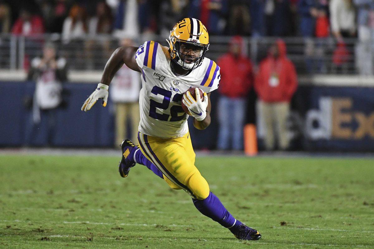 FILE - In this Nov. 16, 2019, file photo, LSU running back Clyde Edwards-Helaire (22) runs the ball during the first half of an NCAA college football game against Mississippi, in Oxford, Miss. Clyde Edwards-Helaire was one of three players from LSU&#8217;s high-powered offense to earn unanimous first-team all-SEC honors when The Associated Press All-Southeastern Conference football team was announced Monday, Dec. 9, 2019. (AP Photo/Thomas Graning, File)