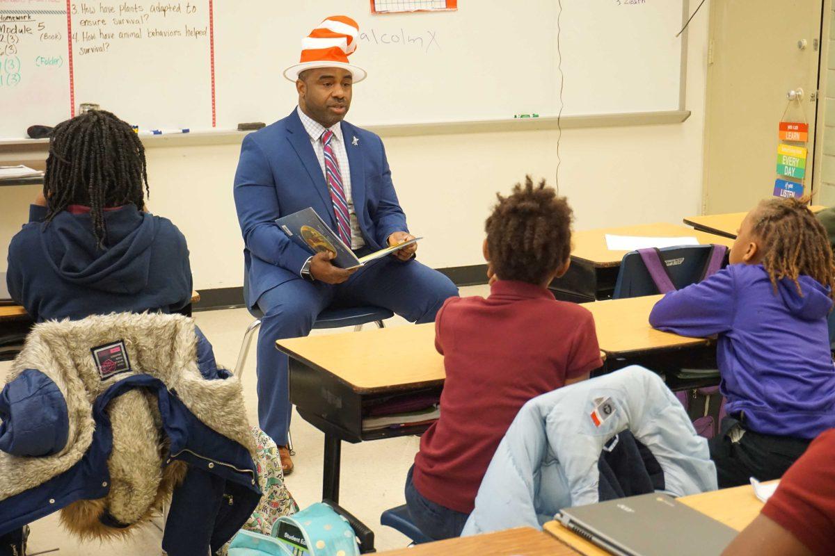 School of Education Interim Dean Roland Mitchell reads to children at Buchanan Elementary on Feb. 28.