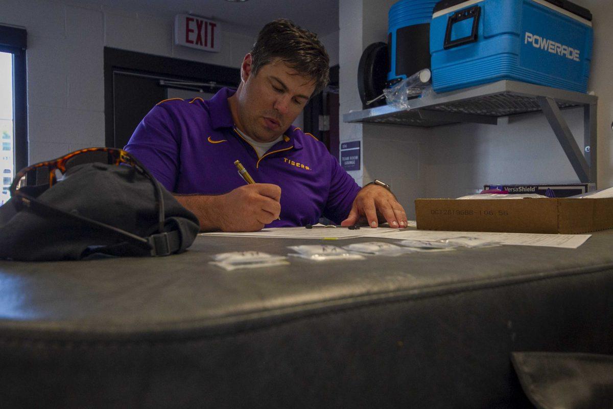 LSU sports science research associate Nathan Lemoine prepares for practice in the Beach Volleyball Facility on Tuesday, Oct. 8, 2019.