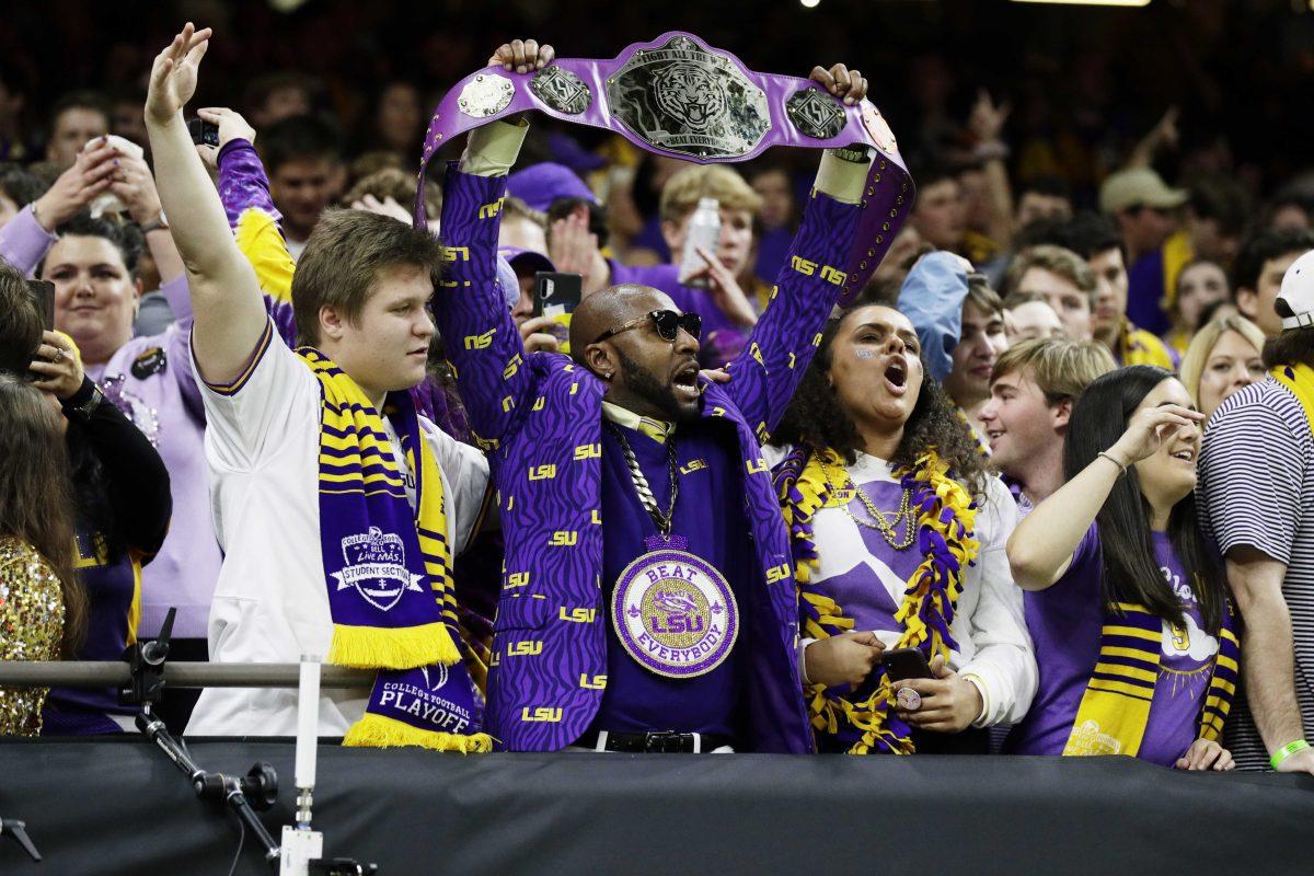 LSU fans cheer before a NCAA College Football Playoff national championship game against Clemson Monday, Jan. 13, 2020, in New Orleans. (AP Photo/Sue Ogrocki)