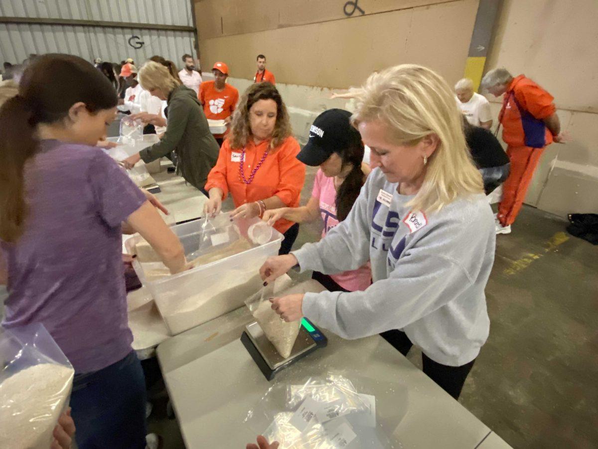 LSU and Clemson University alumni volunteer with Second Harvest Food Bank of Greater New Orleans and Acadiana on Jan. 11.