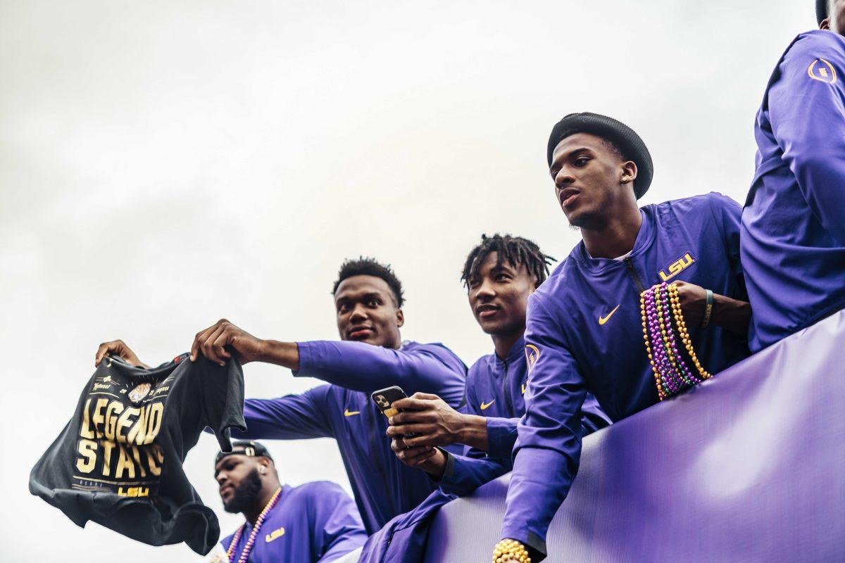 LSU football players ride a truck float on Saturday, January 18, 2020 during LSU's National Championship Parade on Field House Drive.