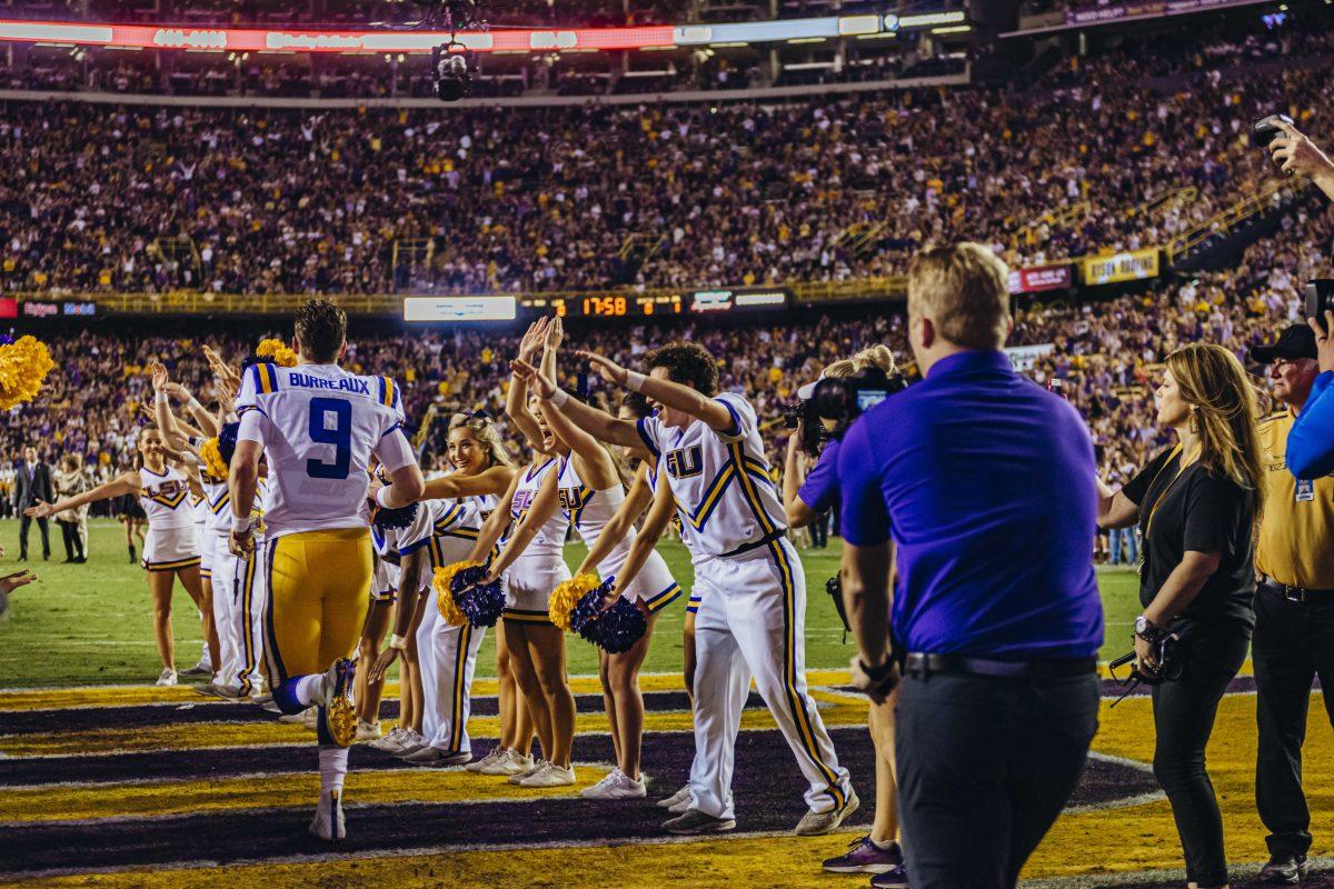 LSU senior quarterback Joe "Burreaux" (9) enters Death Valley before the LSU vs. Texas A&amp;M game on Saturday, November 30, 2019.