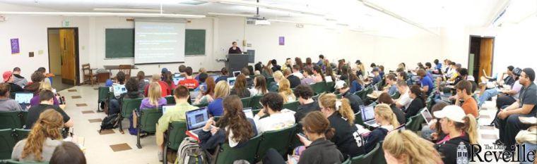 A full class of students listens to a lecture Monday in a classroom in Lockett Hall.