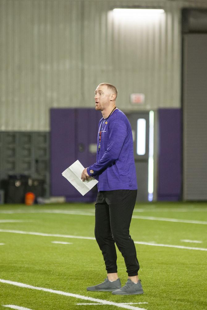 LSU passing game coordinator Joe Brady runs drills in the LSU Indoor Practice Facility on Monday, Aug. 26, 2019.