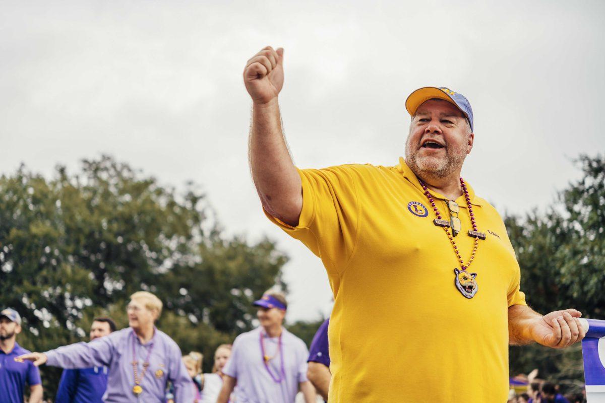 An LSU fan cheers on Saturday, January 18, 2020 during LSU's National Championship Parade on Field House Drive.