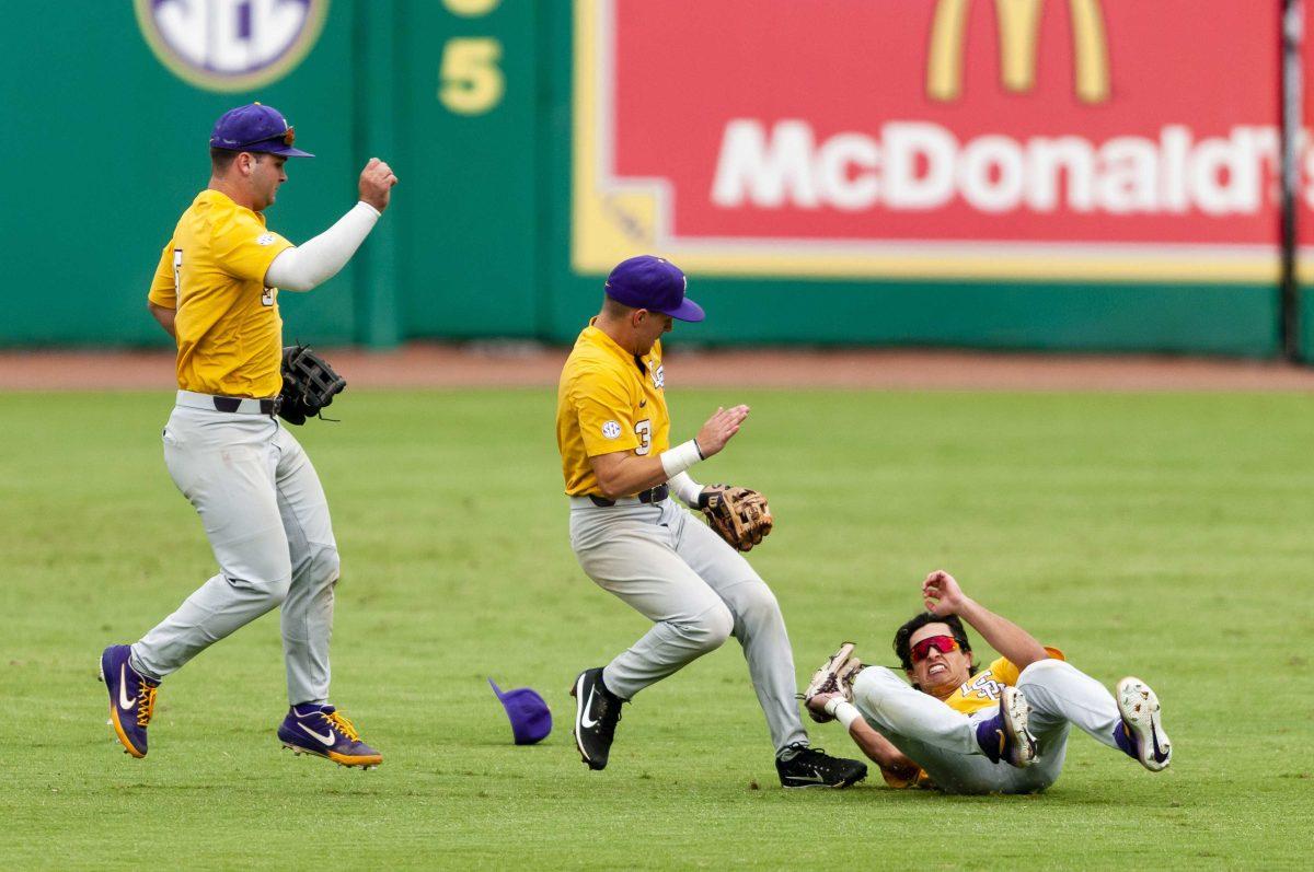 LSU baseball players dive for a fly ball during the Tigers' 4-3 victory over the University of New Orleans in Alex Box Stadium on Sunday, Oct. 27, 2019.