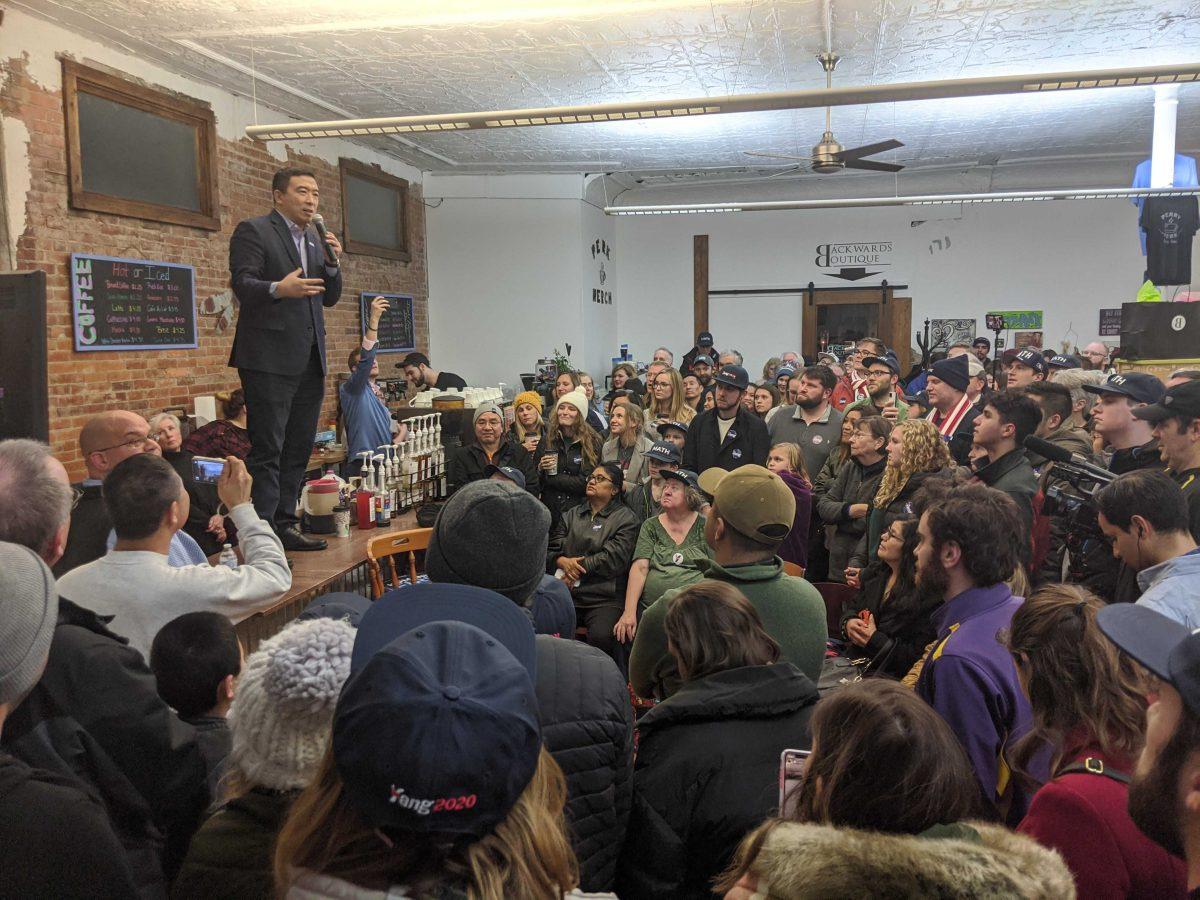 Andrew Yang stands on a counter while speaking to attendees during his event at Perry Perk in Perry, Iowa on Jan. 3, 2020.