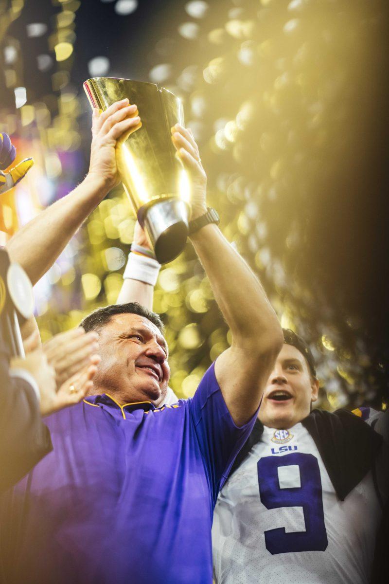 Coach O holds up the trophy on Monday, January 13, 2020 after LSU's 42-25 win against Clemson at the National Championship in the Mercedes-Benz Superdome.