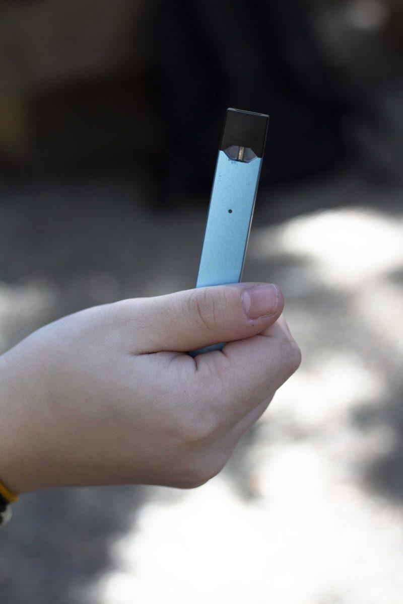 An LSU student holds a Juul in the Quad on Wednesday, Sep. 25, 2019.