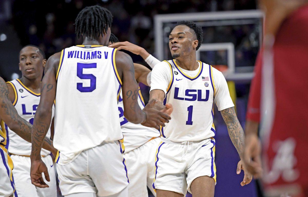 LSU guard Ja'vonte Smart (1) celebrates the dunk play made by LSU forward Emmitt Williams (5) in the first half of an NCAA college basketball game against Alabama, Wednesday, Jan. 29, 2020, in Baton Rouge, La. LSU won 90-76. (AP Photo/Bill Feig)