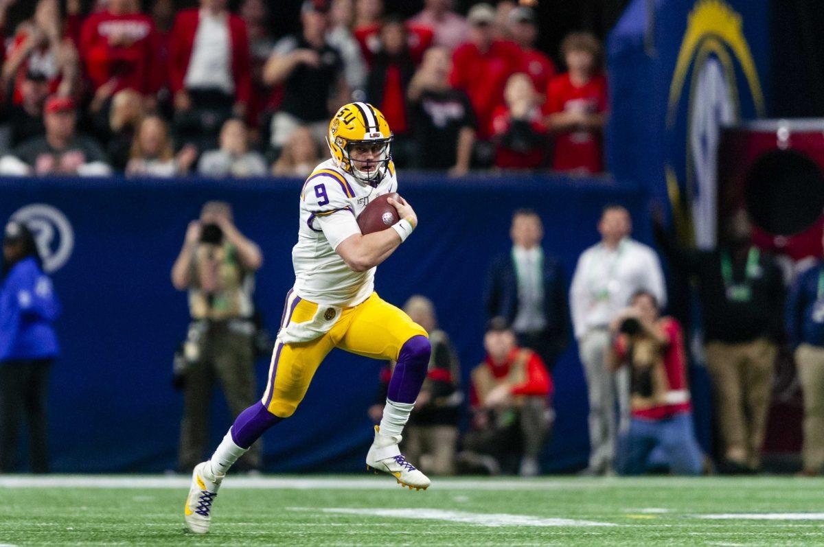 LSU senior quarterback Joe Burrow (9) runs down the field during the Tigers' 37-10 victory over Georgia on Saturday, Dec. 7, 2019, in Mercedes Benz Stadium.