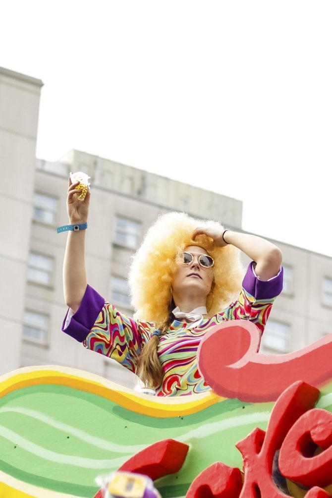 A Mardi Gras float rider throws beads during the Tucks Mardi Gras Parade on Canal St. on Saturday, March 2, 2019.