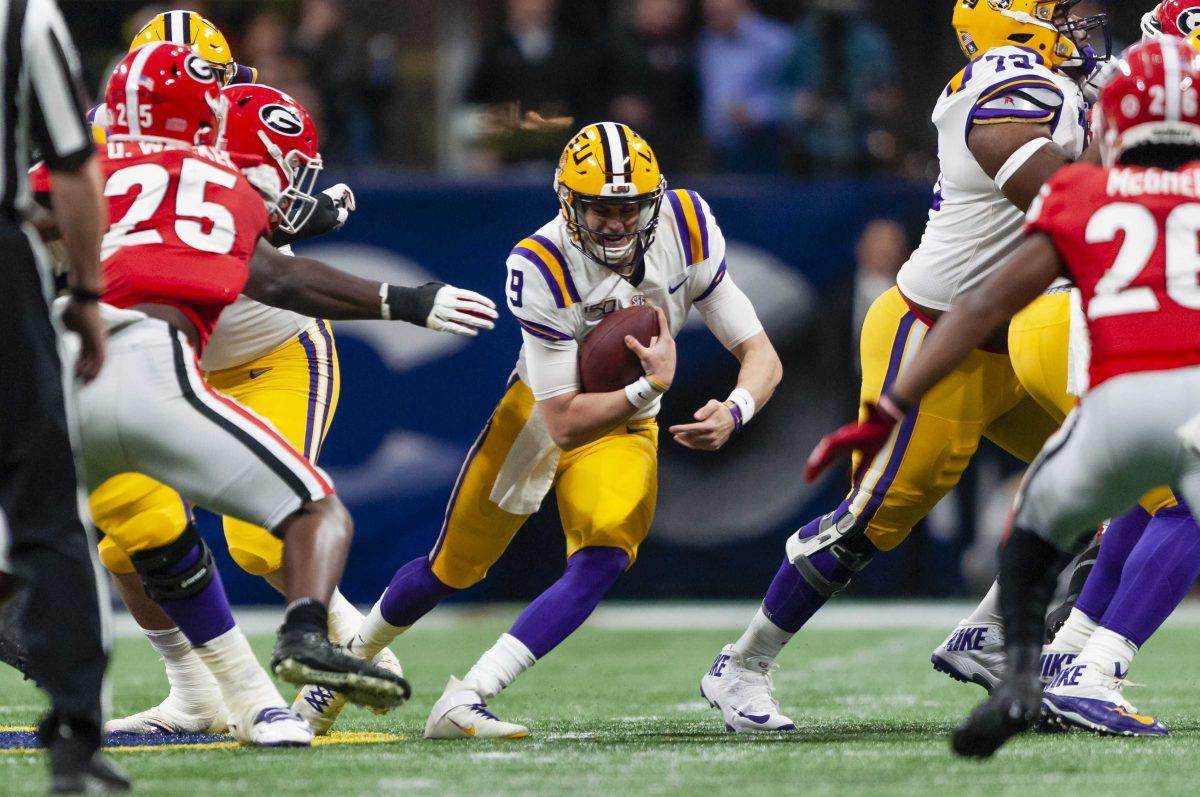 LSU senior quarterback Joe Burrow (9) runs down the field during the Tigers' 37-10 victory over Georgia on Saturday, Dec. 7, 2019, in Mercedes Benz Stadium.