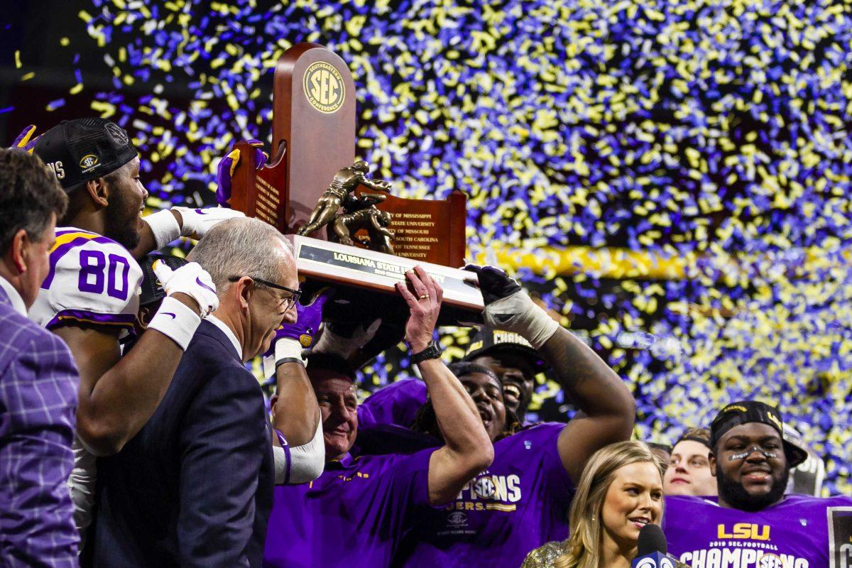 The LSU football team celebrates after the Tigers' 37-10 victory over Georgia on Saturday, Dec. 7, 2019, in Mercedes Benz Stadium.