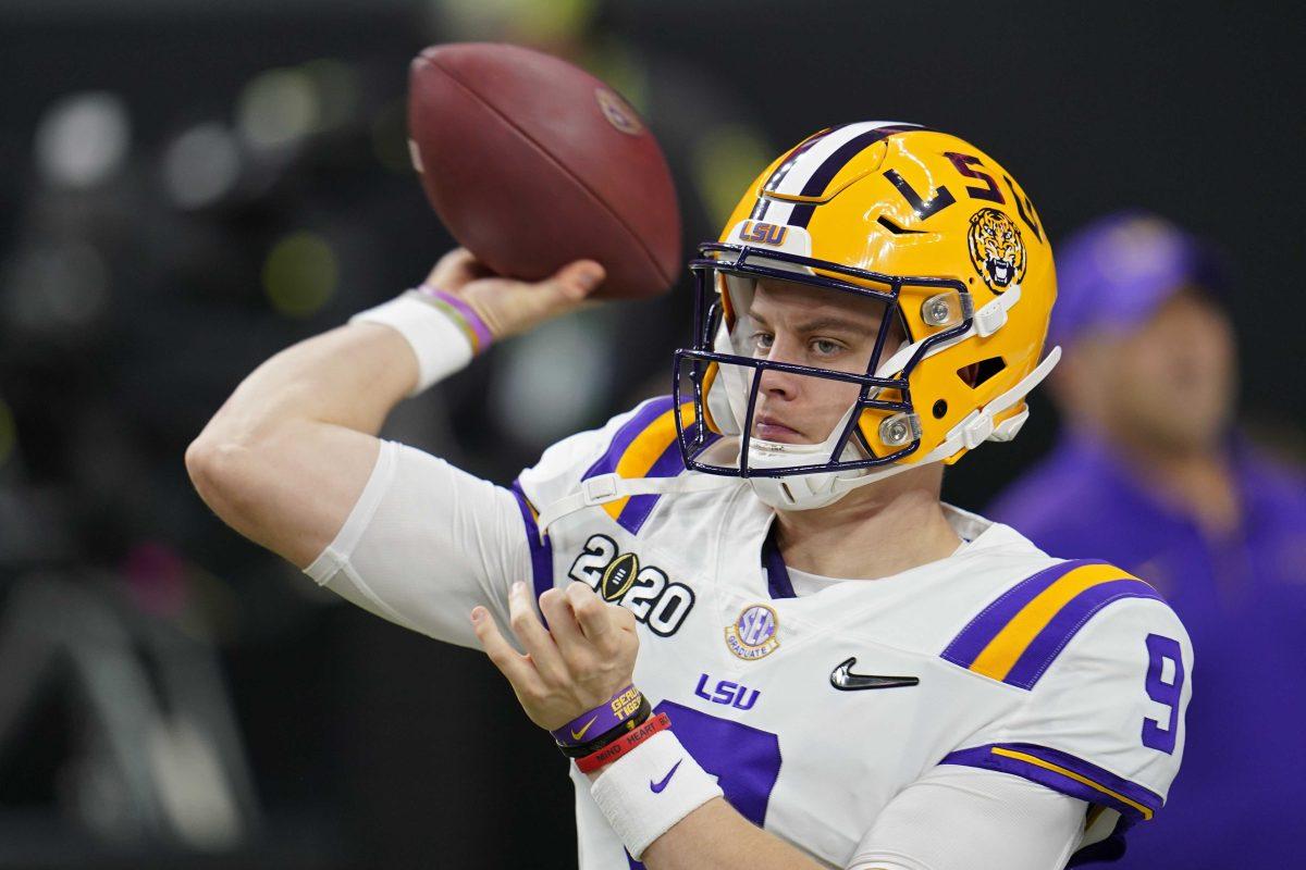 LSU quarterback Joe Burrow warms up before a NCAA College Football Playoff national championship game against Clemson Monday, Jan. 13, 2020, in New Orleans. (AP Photo/David J. Phillip)