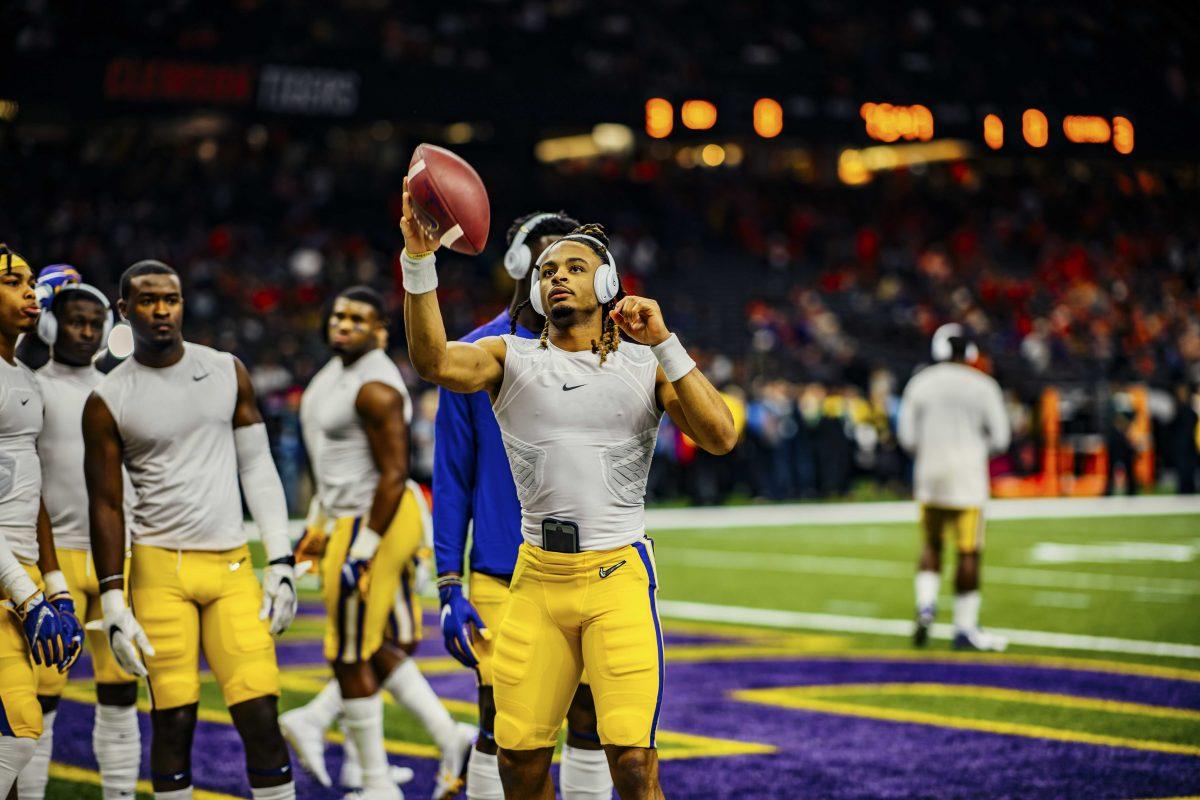 LSU freshman quarterback Peter Parrish (8) catches a ball on the field on Monday, January 13, 2020 before LSU's 42-25 win against Clemson in the Mercedes-Benz Superdome.