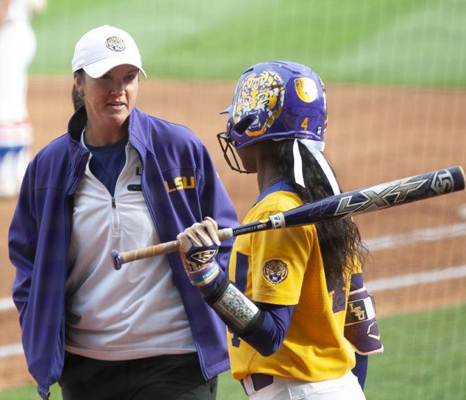 LSU junior outfielder Aliyah Andrews (4) talks to LSU softball coach Beth Torina during the Tigers&#8217; 8-0 win over the Florida Gators on Sunday, March 17, 2019, at Tiger Park.