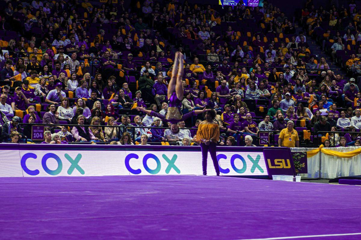 LSU Senior All-Around Ruby Harold does a flip during her floor routine on Sunday, Feb. 16, 2020 during the gymnastics meet agains University of Kentucky in the PMAC.