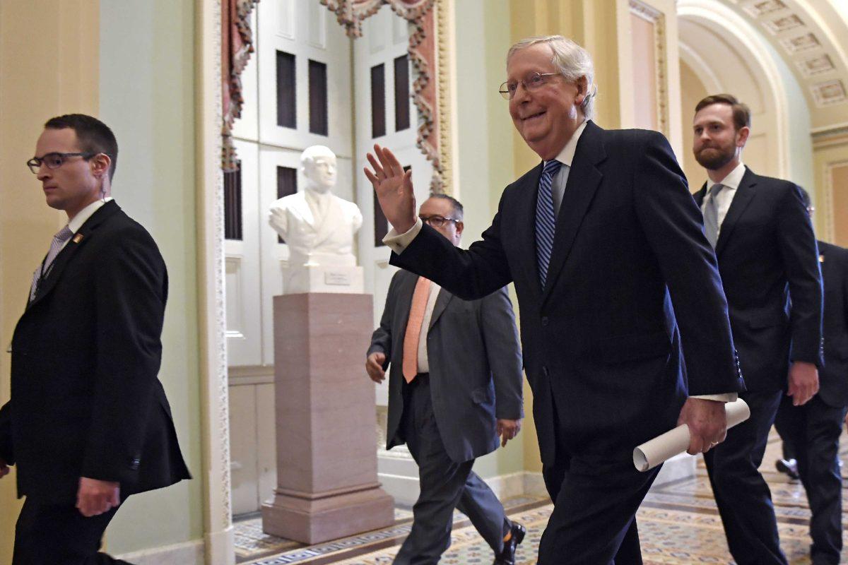 Senate Majority Leader Mitch McConnell of Ky., walks on Capitol Hill in Washington, Wednesday, Feb. 5, 2020, following a vote in the Senate to acquit President Donald Trump on both articles of impeachment. (AP Photo/Susan Walsh)