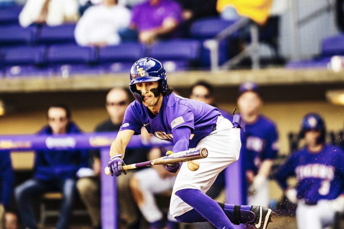 LSU baseball sophomore Giovanni Digiacomo (7) bunts the ball during LSU's 7-4 victory against Indiana in Game 2 on Saturday, Feb. 15, 2020 in Alex Box.