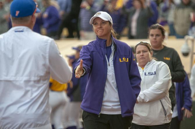 LSU softball coach Beth Torina congratulates Florida softball coaching staff during the Tigers&#8217; 8-0 win on Sunday, March 17, 2019, at Tiger Park.