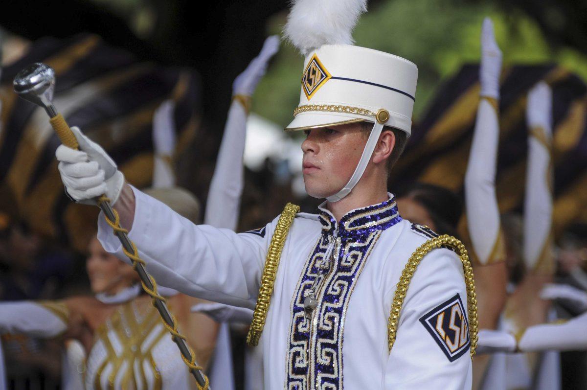 Drum Major leads the band down Victory Hill on Saturday, Sept. 14, 2019.