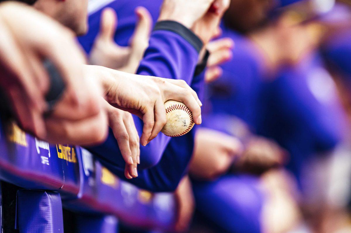 An LSU baseball player holds a baseball during LSU's 7-4 victory against Indiana in Game 2 on Saturday, Feb. 15, 2020 in Alex Box.