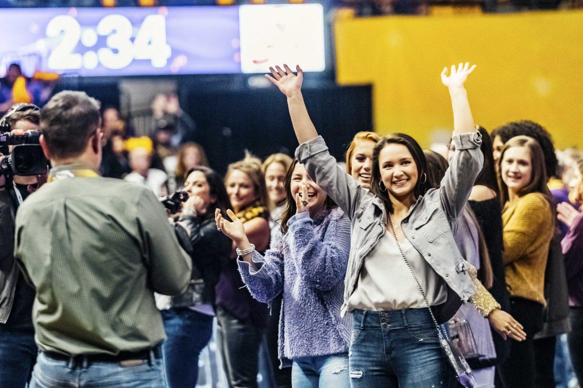 LSU gymnastics alumna Sarah Finnegan waves to the crowd on Friday, January 2020 during LSU's 196.775 to 196.425 loss to Alabama in the PMAC.