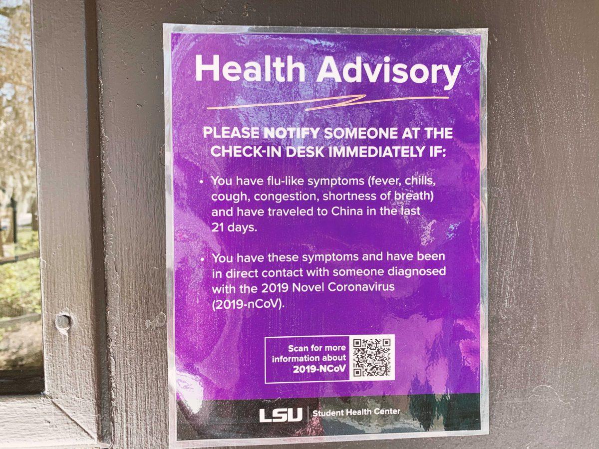 A sign hangs outside the Student Health Center warning students who have flu-like symptoms, recently traveled to China or come into contact with someone diagnosed with coronavirus to notify the front desk.