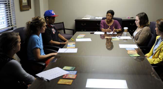 Erin Anthony, a counselor at the University Center for Freshman Year, leads a group of students during a True Colors workshop Tuesday, October 1, 2013 in Allen Hall.