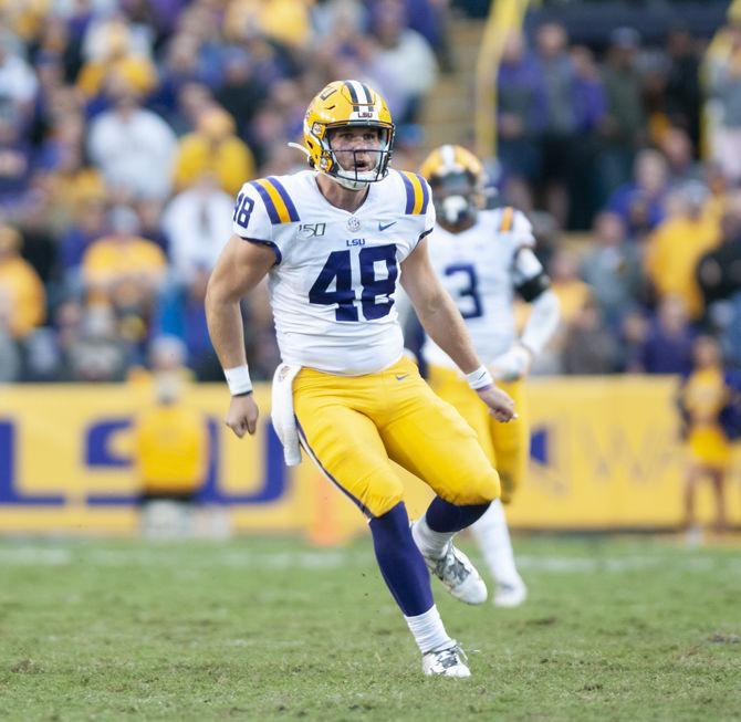 LSU senior deep snapper Blake Ferguson (48) runs toward the ball during the Tigers' 23-20 win over Auburn on Saturday, Oct. 26, 2019, at Tiger Stadium.