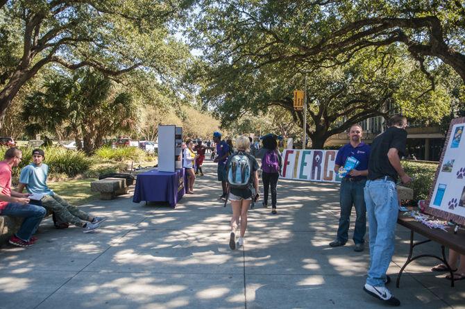 LSU students walk past different organizations set up on Thursday, Oct. 15, 2015 in Free Speech Alley.