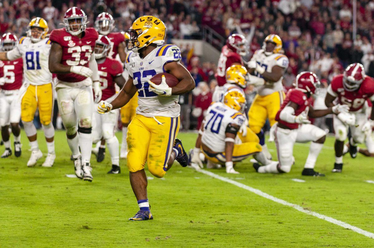 LSU junior running back Clyde Edwards-Helaire (22) runs for a touchdown during the Tigers' 46-41 victory over Alabama in Bryant-Denny Stadium on Saturday, Nov. 9, 2019.