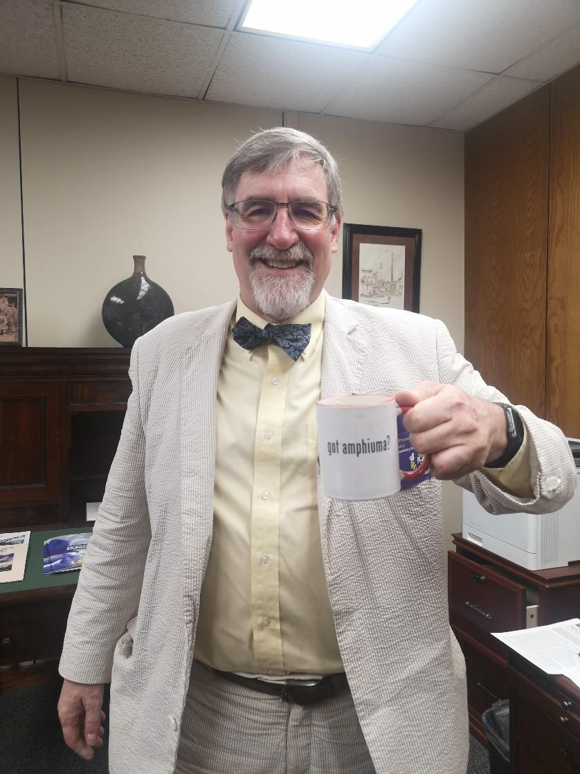 Dr. John Pojman, chair of the LSU chemistry department is holding his favorite coffee mug which reads, &#8220;got amphiuma?&#8221;. The saying is based on the famous advertising campaign, &#8220;got milk?&#8221;, by Goodby Silverstein and partners that have circulated the internet since 1993.