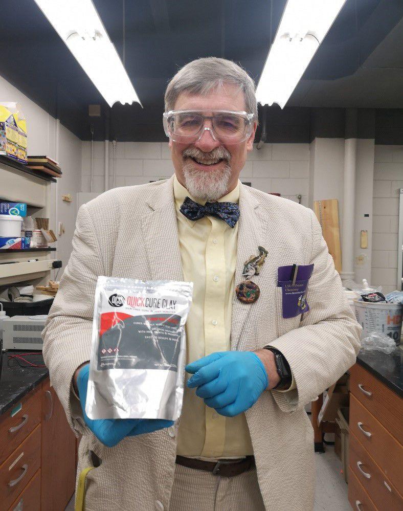 Dr. John Pojman, chair of the LSU chemistry department and award-winning scientist, is standing with his artistic creation, QuickCure Clay. Pojman created the clay whilst working in a lab one day with the intention of making a substance for home repairs. After a student suggested using the clay for sculpting, Pojman decided to market the product as QuickCure Clay. QuickCure Clay is now used by many artists around the U.S.