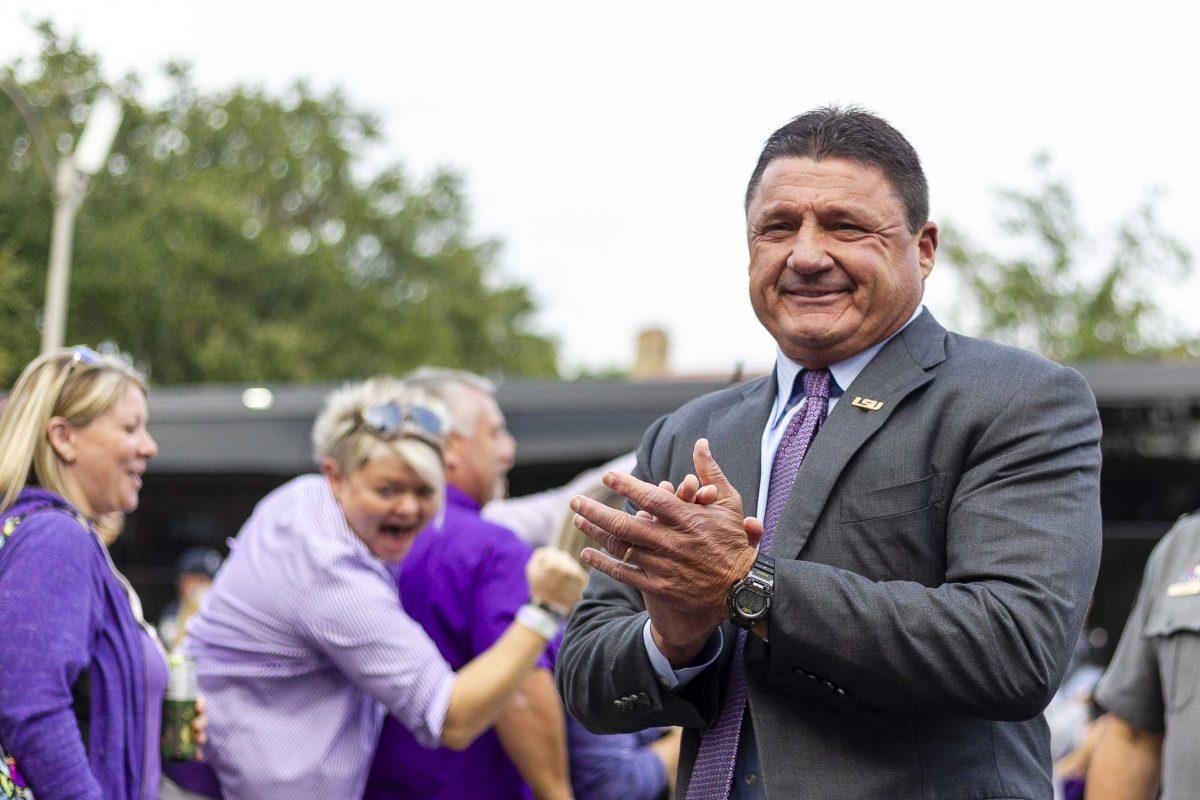 LSU football coach Ed Orgeron walks down Victory Hill on Saturday, Oct. 12, 2019.