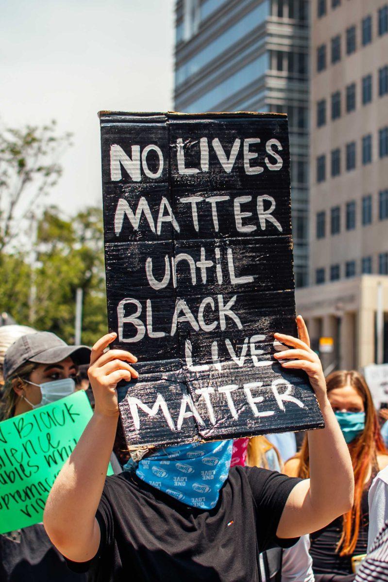 Protesters hold up their signs on Sunday, May 31, 2020 during the protest of the death of George Floyd at the State Capitol in Downtown Baton Rouge.