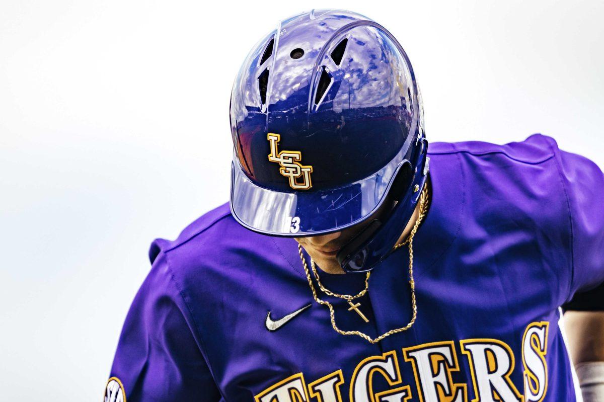 LSU baseball junior Saul Garza (13) runs to first base during LSU's 7-4 victory against Indiana in Game 2 on Saturday, Feb. 15, 2020 in Alex Box.