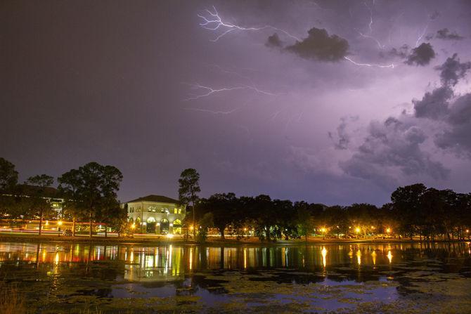 Lightning flashes over the University Lake on Wednesday, Sept. 19, 2018.