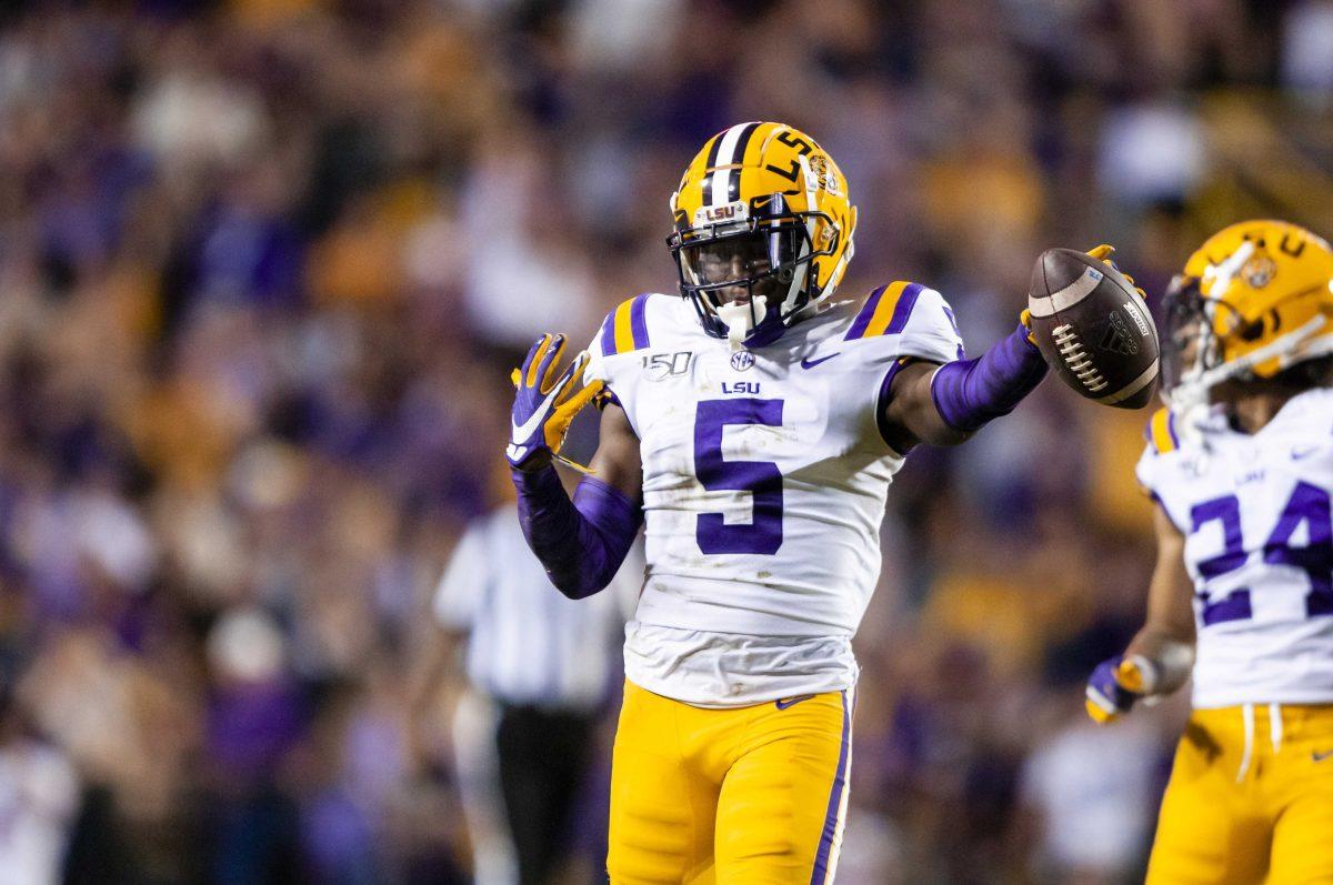 LSU junior safety Kary Vincent Jr. (05) celebrates after intercepting a pass during the Tigers' 50-7 victory over Texas A&amp;M on Saturday, Nov. 30, 2019, at Tiger Stadium.