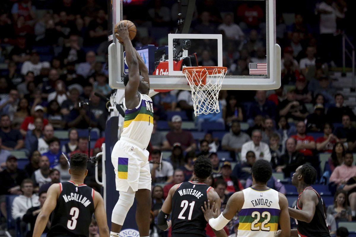 New Orleans Pelicans forward Zion Williamson (1) dunks the ball against the Portland Trail Blazers in the first half of an NBA basketball game in New Orleans, Tuesday, Feb. 11, 2020. (AP Photo/Rusty Costanza)