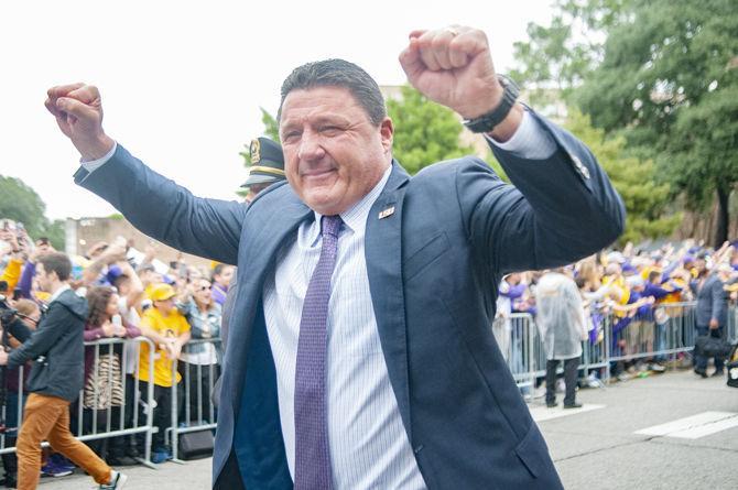 LSU football coach Ed Orgeron walks down Victory Hill on Saturday, Oct. 26, 2019.