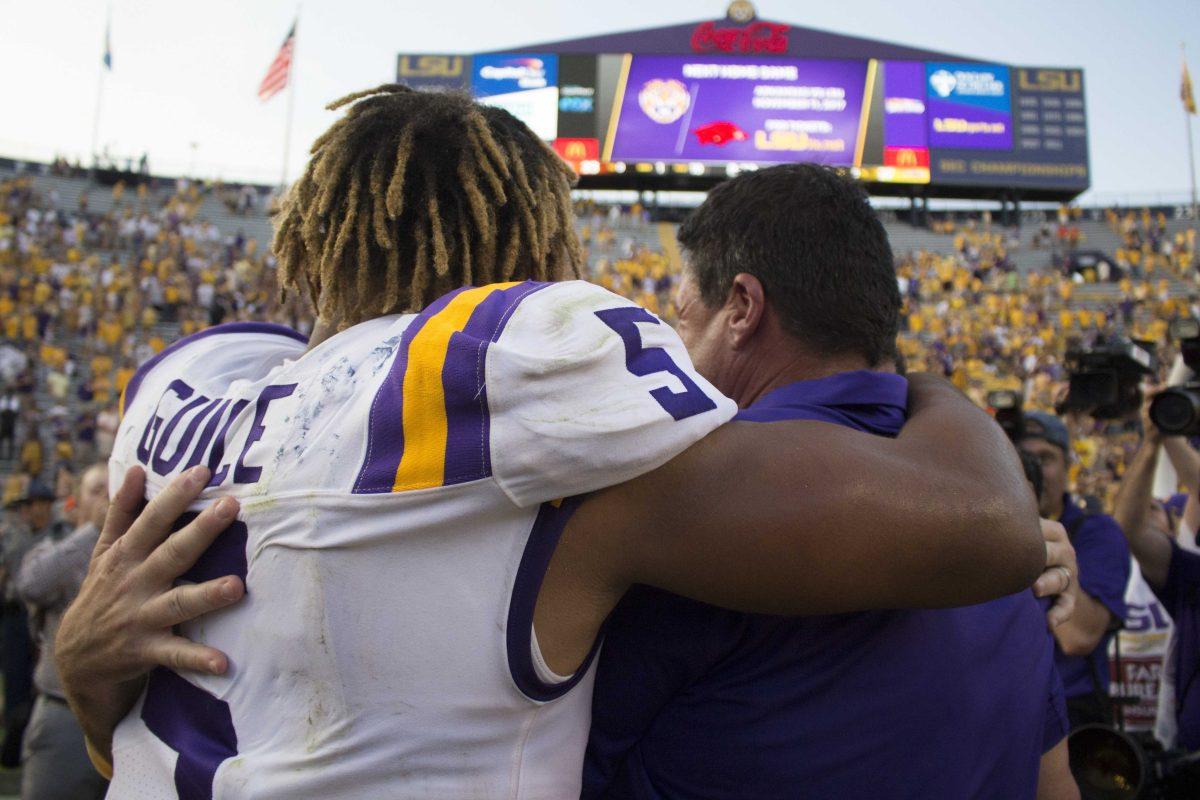 LSU junior running back Derrius Guice (5) embraces LSU football coach Ed Orgeron after the LSU Tigers' 27-23 victory against Auburn on Saturday, Oct. 14, 2017 in Tiger Stadium.