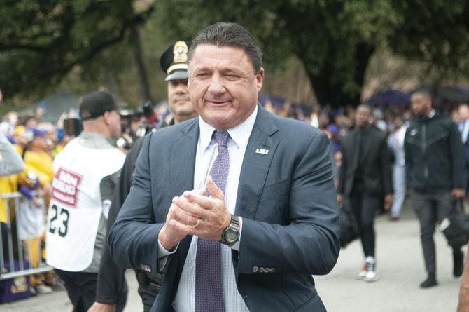 LSU football coach Ed Orgeron walks down Victory Hill on Saturday, Oct. 26, 2019.