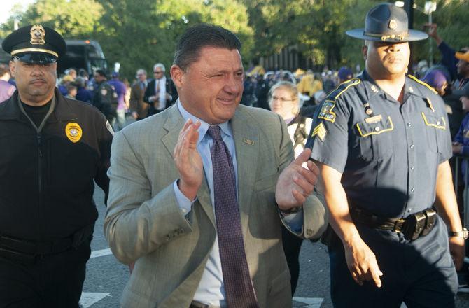 LSU football coach Ed Orgeron walks down Victory Hill on Saturday, Nov. 23, 2019.