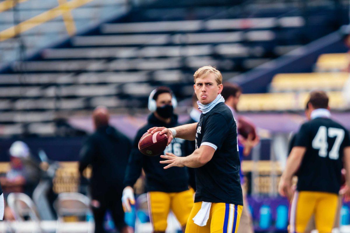 LSU football junior quarterback Myles Brennan (15) practices Saturday, Sep. 26, 2020 before LSU's 44-24 loss against Mississippi State in Tiger Stadium.