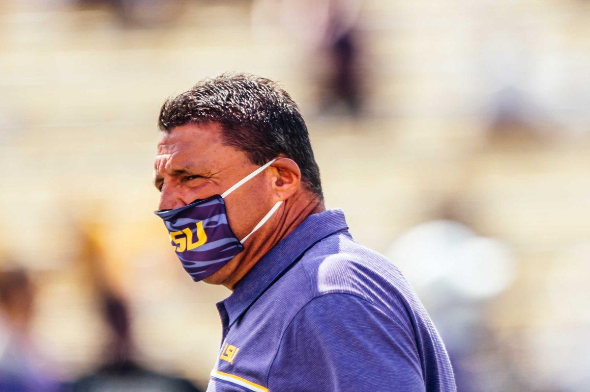 LSU football coach Ed Orgeron walks the field Saturday, Sep. 26, 2020 before LSU's 44-24 loss against Mississippi State in Tiger Stadium.