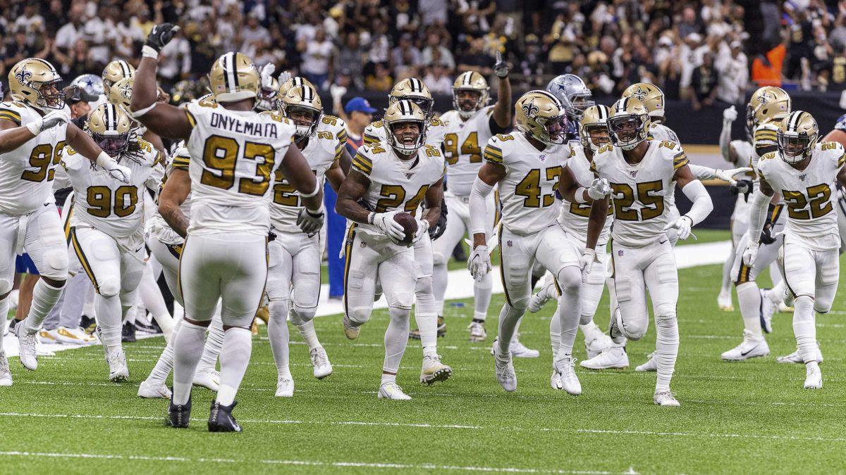 New Orleans Saints' Vonn Bell (24) and the rest of the defense celebrate after an interception against the Dallas Cowboys during an NFL football game, Sunday, Sept. 29, 2019, in New Orleans. (Scott Clause/The Daily Advertiser via AP)